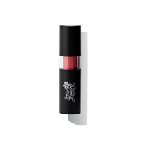 A black tube of lipstick with a pink hue visible at the bottom, set against a white background. The brand's logo is visible on the tube.