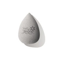 A gray eco beauty blender designed for makeup application, made from biodegradable materials.