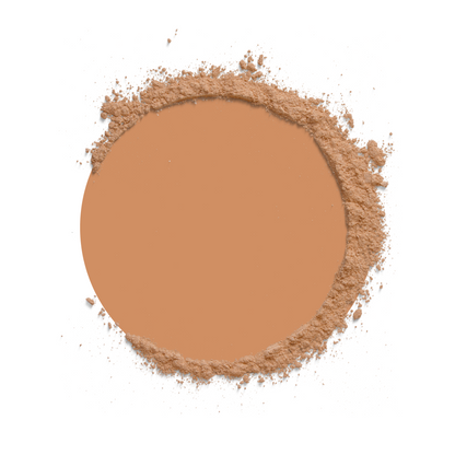 Circular compact of brown powder on a white background