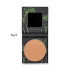 Compact powder with palm tree design on a white background